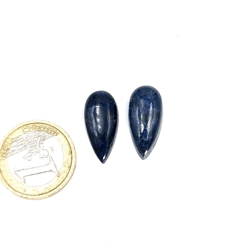 992 - A pair of Pear shaped Cabochon cut Blue Sapphires 25 carats. 
Total Weight: 25 Carats.