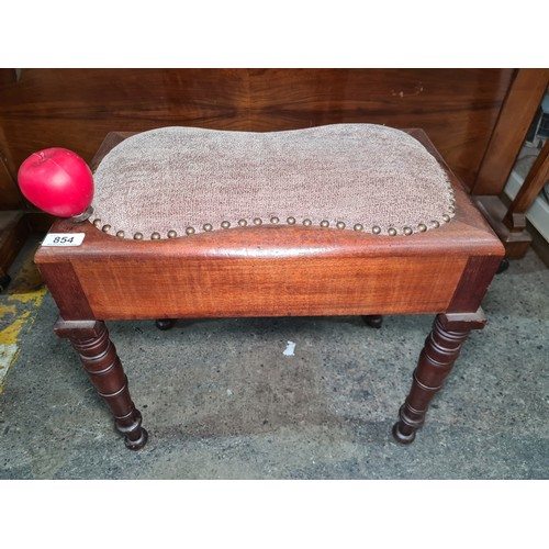 854 - A gorgeous vintage piano stool with turned wood tapering legs and a kidney shaped cushion with studd... 