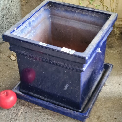 904 - A very nice example of a terracotta square planter with matching base, both featuring a rich navy bl... 