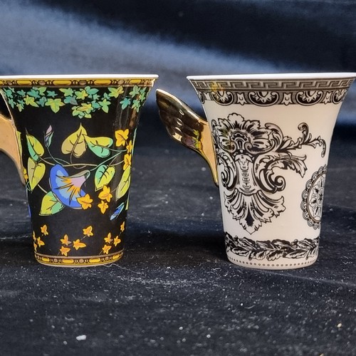 149 - Star Lot : A fabulous pair of ornate porcelain demitasse cups and saucers in the Versace design by R... 