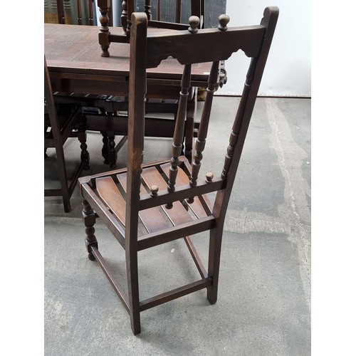 873 - Star lot : A solid well made early 20th Century ercol dining table along with six matching dinning c... 