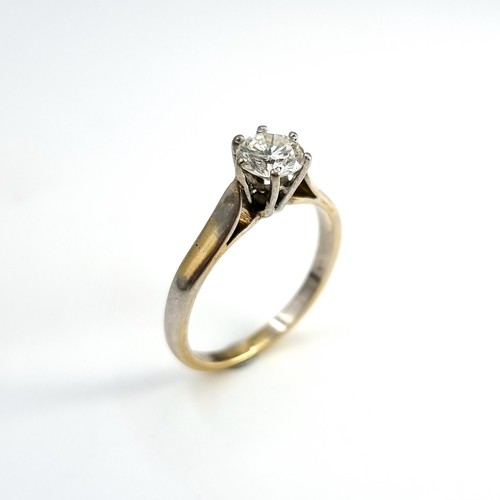 46 - Super Star Lot : An outstanding 18 carat bi-colour six claw solitaire ring with Tiffany setting. Est... 