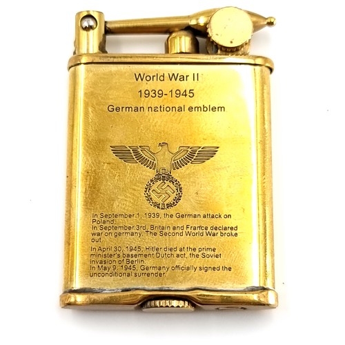 4 - A vintage  brass lighter with inscription 'WWII 1939-45 German national emblem' With significant WW2... 