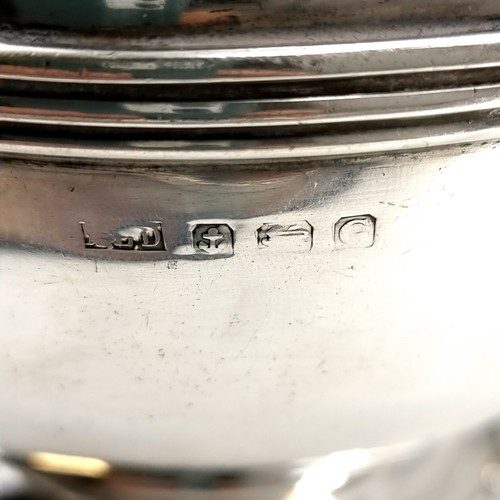 16 - Star Lot : A nice example of a solid Sterling Silver  tea pot hallmarked Birmingham 1931 set with an... 