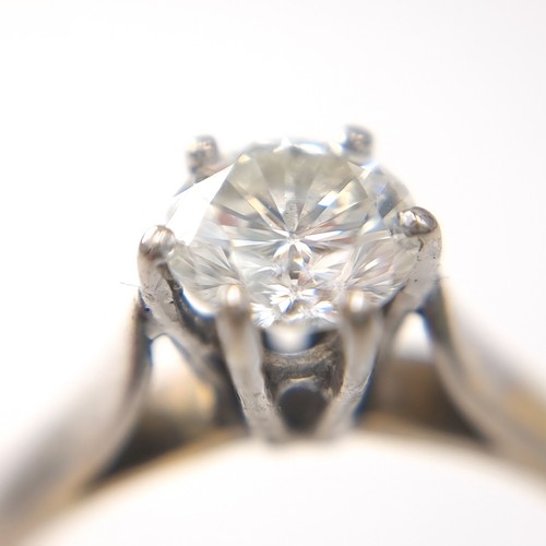 46 - Super Star Lot : An outstanding 18 carat bi-colour six claw solitaire ring with Tiffany setting. Est... 