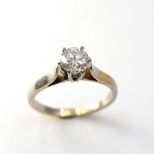 46 - Super Star Lot : An outstanding 18 carat bi-colour six claw solitaire ring with Tiffany setting. Est... 