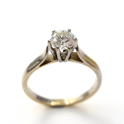 46 - Super Star Lot : An outstanding 18 carat bi-colour six claw solitaire ring with Tiffany setting. Est... 