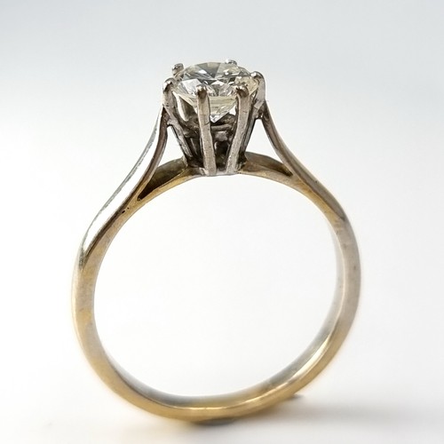 46 - Super Star Lot : An outstanding 18 carat bi-colour six claw solitaire ring with Tiffany setting. Est... 