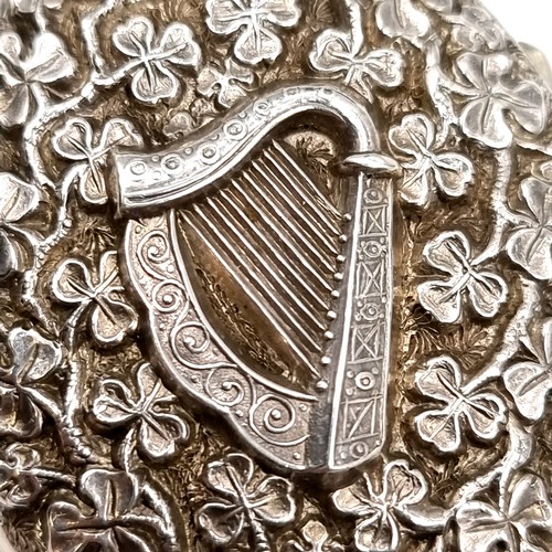 981 - An unusual vintage Sterling Silver locket with Harp and Shamrock motifs in relief. With a sterling S... 