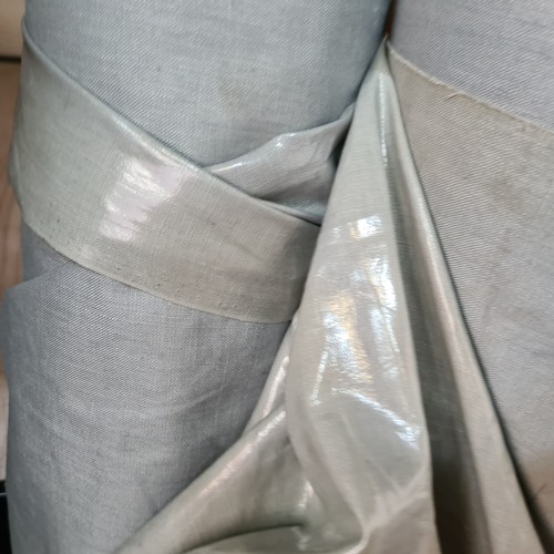 848 - A roll of grey fabric for furniture reupholstery.