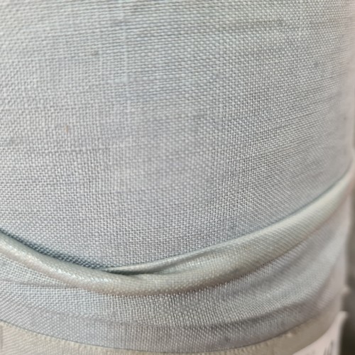 849 - A roll of grey fabric for furniture reupholstery.