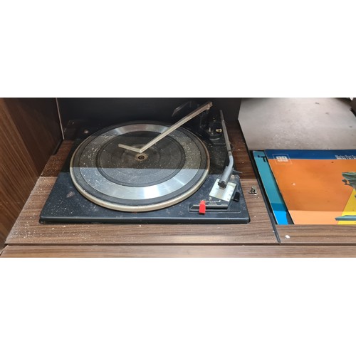 868 - A very cool 1960s vintage radiogram  music centre with concealed Garrard 2025 TC turntable along wit... 