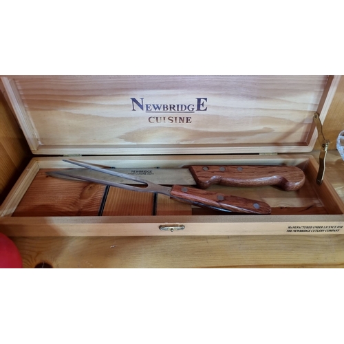 403 - An as new Newbridge Cuisine carving set with wooden handles, housed in a wooden presentation box wit... 