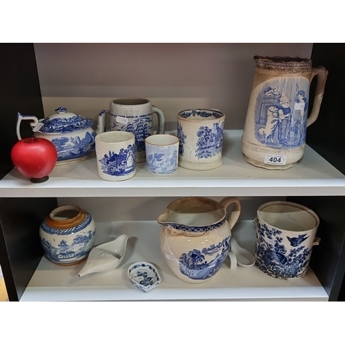 404 - A wonderful collection of  two shelves 11 mostly antique blue and white  ironstone pottery items. In... 