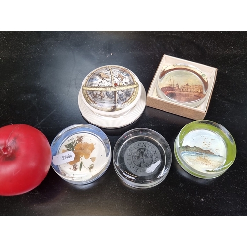 410 - Six paperweights including 5 glass and one ceramic example. Featuring diverse designs, such as flora... 