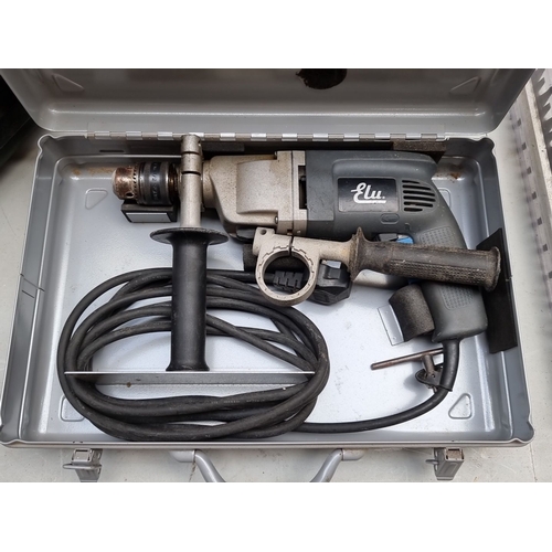 412 - Elu electric power hammer drill model no. SB215 - comes in original metal case. It includes handle a... 