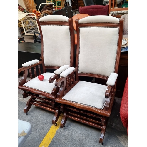 416 - Star Lot : Pair of fantastic antique high-back, wooden framed rocking armchairs with cream upholster... 