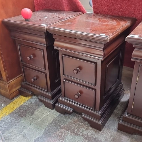 447 - Star Lot : A Pair of solid mahogany bedside tables / cabinets with two drawers and hidden drawer to ... 