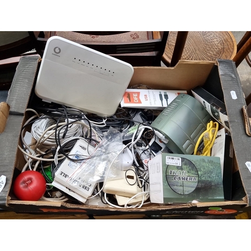 450 - A mixed lot including a, various data cables (ADATA, DFE), a trail camera, networking cables, and as... 