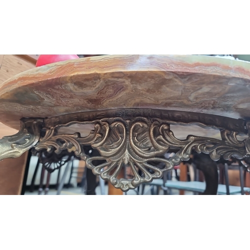 459 - Star Lot : A very elegant vintage French onyx marble topped coffee table with ornate brass metal leg... 