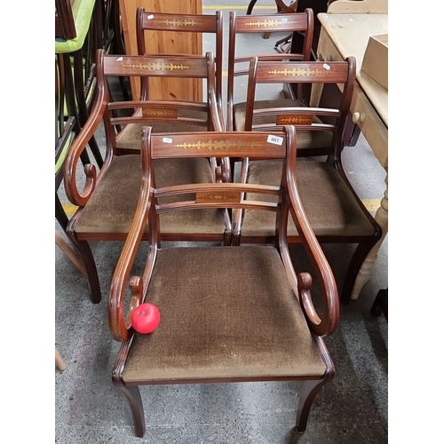 461 - A set of six Regency-style mahogany dining chairs including carvers. Featuring intricate brass inlay... 