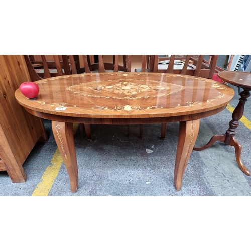 463 - Star Lot : A stunning Italian Sorrento oval inlaid wood coffee table. Featuring intricate floral mar... 