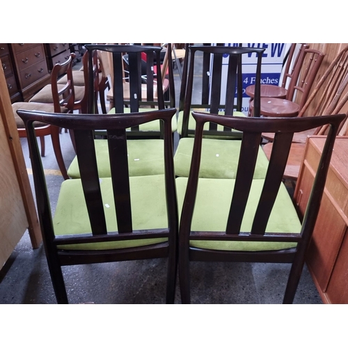 466 - Six dark mahogany mid century  dining chairs with lime green suede upholstered seats. These chairs f... 