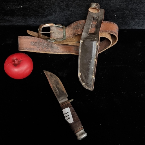 111 - A William Rodgers of Sheffield scout knife. In original belt leather sheath.