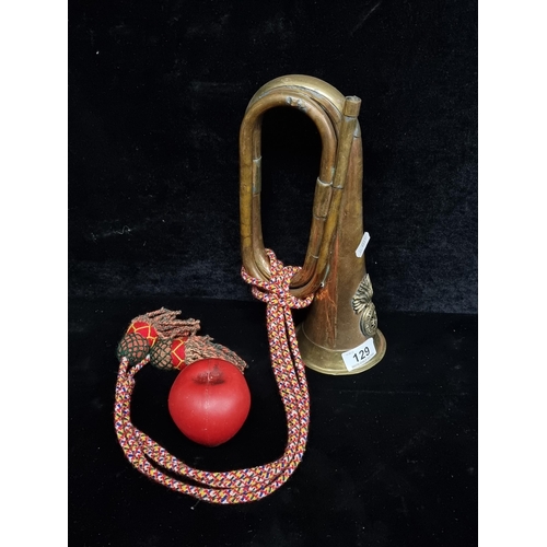 129 - A brass and copper Royal Welsh Fusiliers 23 Regiment signal military bugle. Nice colourful rope atta... 