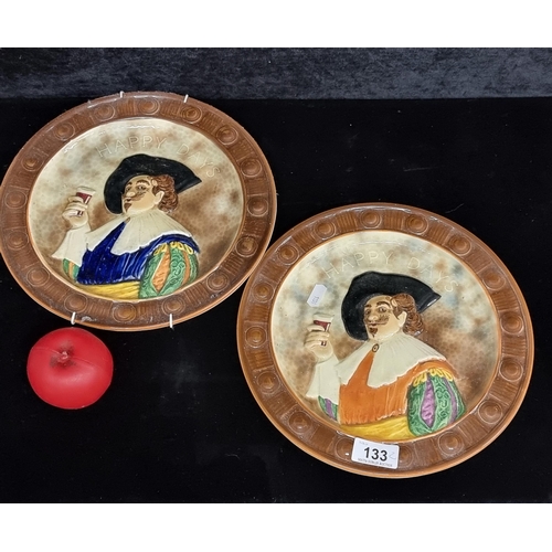 133 - A pair of vintage Falcon Ware Majolica Cavalier plates reading Happy Days.