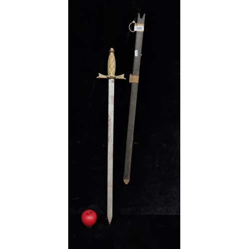 145 - A vintage Rein action sword with brass handle and hand guard with sheath.