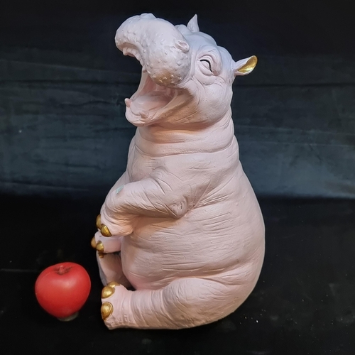 174 - A large characterful statue of a pink Laughing hippopotamus. From a Top Uk interior Design Company.