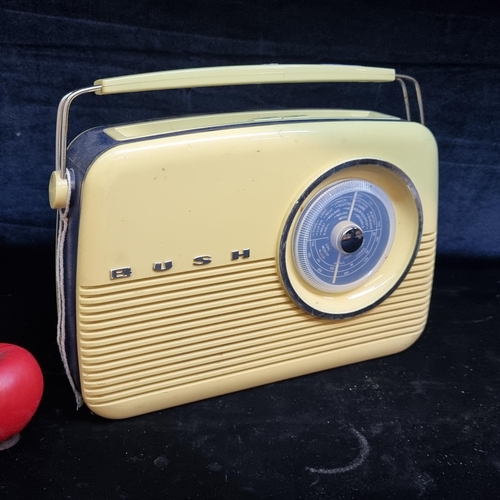 176 - An iconic vintage Bush transistor radio. In a fab yellow retro colour and a bezel twist to change th... 