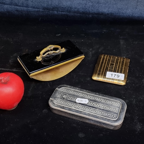 179 - A trio of vintage items including an ink blotter, a Rolls branded razor and a cigarette case.