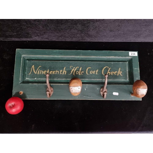 238 - A fun handmade coat rack with four hooks, two of which depict the head of an antique wooden golf dri... 