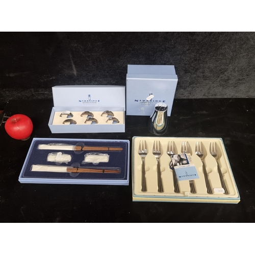 248 - Four new in box Newbridge Silverware items including a salt and pepper, six dessert forks, six napki... 