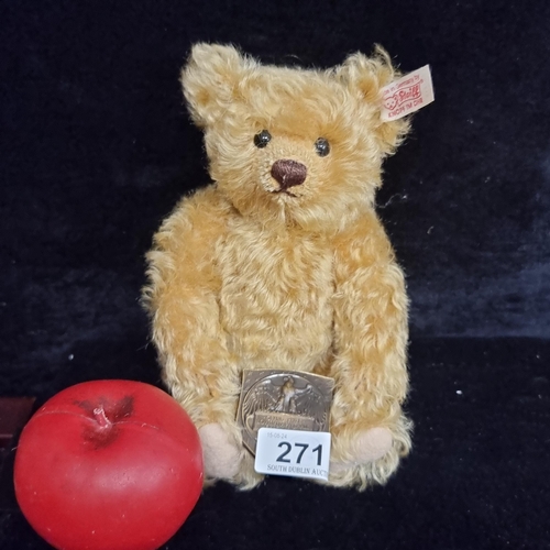 271 - A original Steiff exhibition bear holding a metal plaque reading 