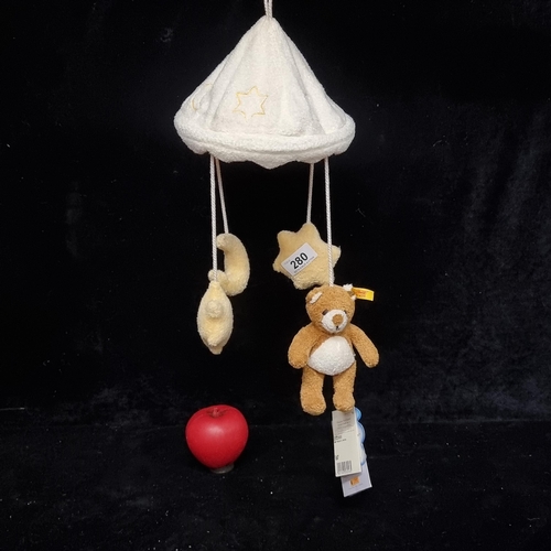 280 - A Steiff mobile teddy bear, moon and two stars with rattle brand new with original tags.