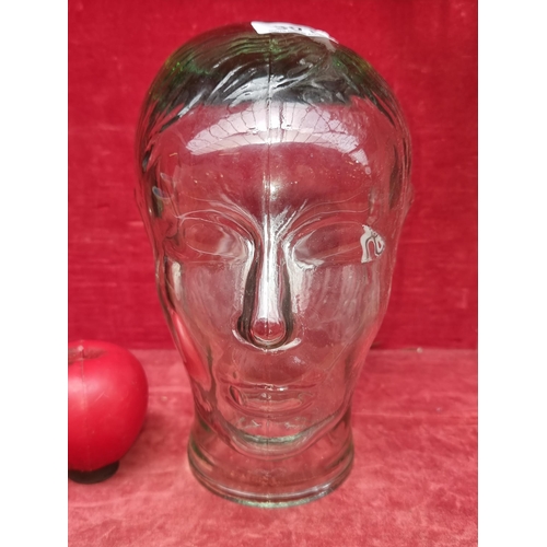 301 - An unusual pressed glass head sculpture.