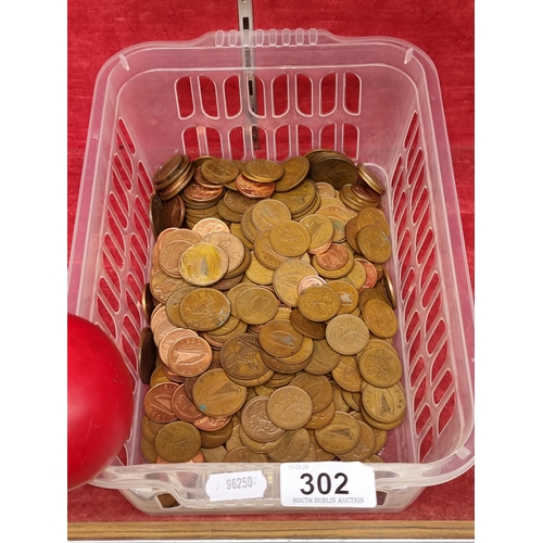 302 - A basket of unchecked Irish coins.