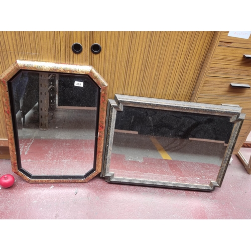 305 - Two bevelled glass hall mirrors with marble paint design frames.