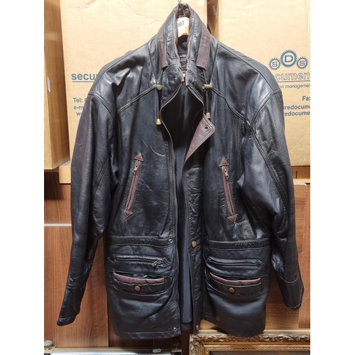 307 - A handsome mens genuine black leather zipped jacket with burgundy leather accents. Size label XS.