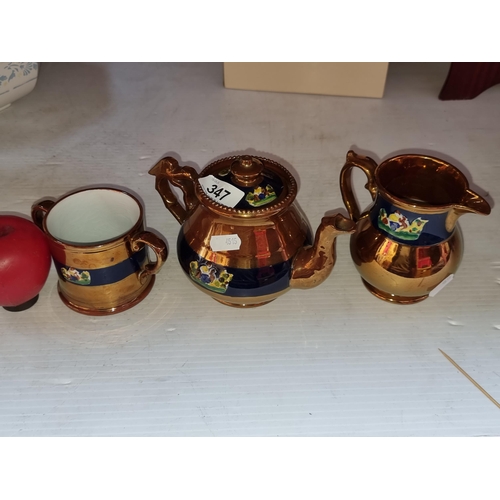 347 - A set of three antique Copper lusterware creamer, a double handed cup and tea pot with handpainted e... 