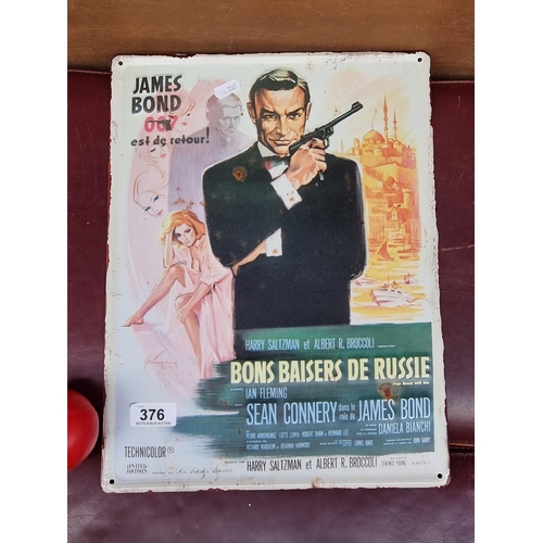 376 - A metal wall plaque featuring 'French James Bond 007, .