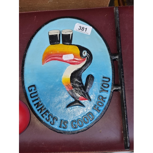 381 - A vintage style Guinness advertising cast iron wall-mount with iconic toucan, vibrant hand-painted d... 