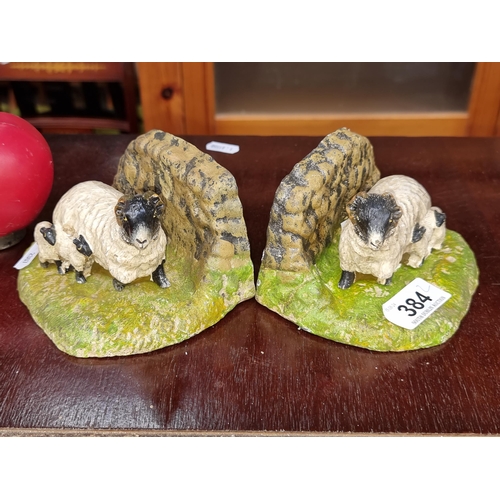 384 - A pair of delightful cast iron book ends in the form of  Sheep and lambs.