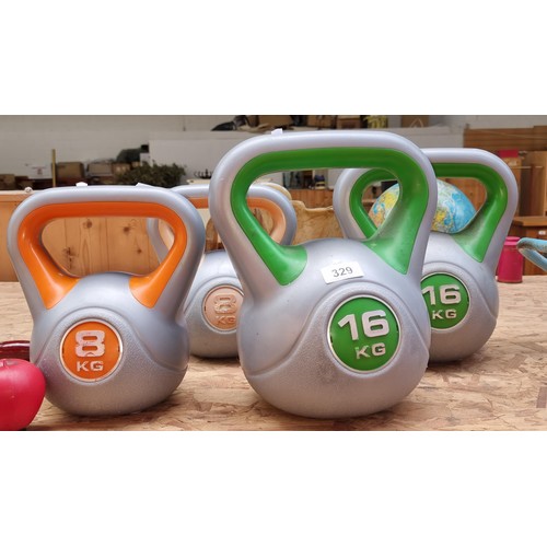 329 - Four superb kettlebell weights including two 16KG and two 8KG examples.