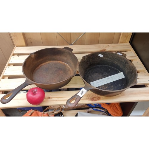 326 - A heavy pair of Queen West cast iron skillet frying pans.