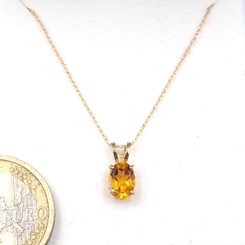 1 - Star Lot : A pretty citrine drop pendant set in nine carat gold together with a nine carat gold chai... 