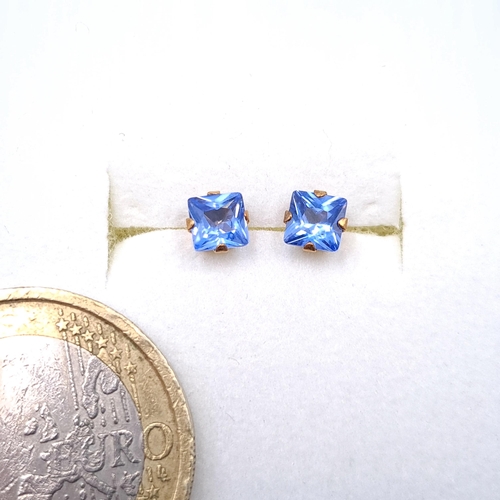 16 - A pair of blue Tanzanite nine carat gold stud earrings. Boxed.